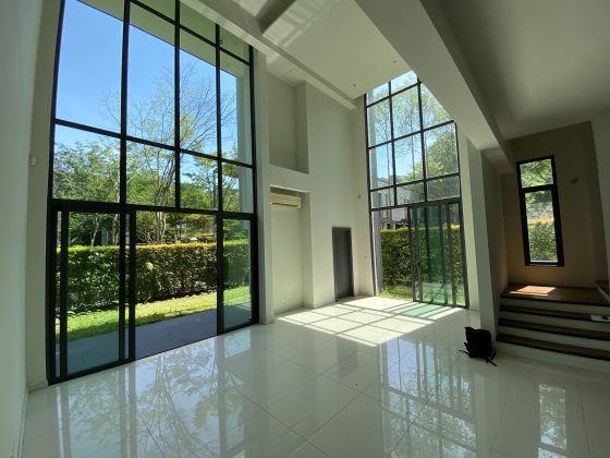 A bare living room facing the garden