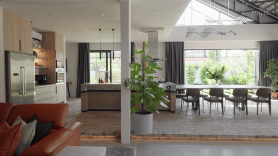 awan kuning terrace house OTCQ Architects green facade plants architecture interior design greenery oscar tan design seed biophilic biophilic house green house dining kitchen countertop rammed earth countertop dining