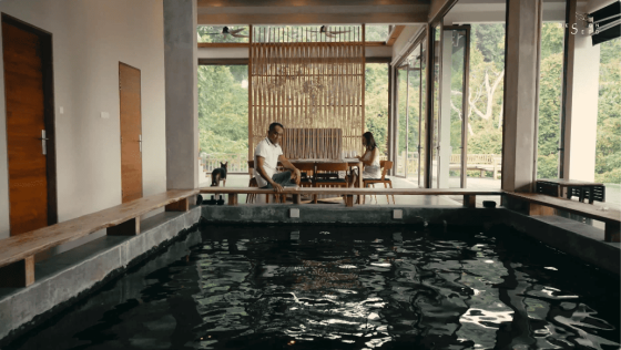 floating treehouse nature forest open to forest house eco friendly green family retreat forest view family home wooden design interior design architecture design seed inch lim inchscape elderly couple mature couple retirement home relax relaxing inch lim inchscape designer architect rubber estate forest jungle Malaysia woman looking at forest forest scenery nature beautiful homes green homes front door entrance pond living room lounge foyer