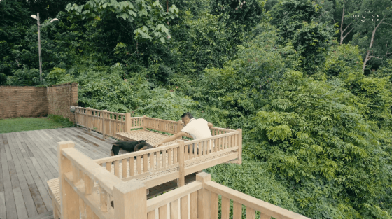 floating treehouse nature forest open to forest house eco friendly green family retreat forest view family home wooden design interior design architecture design seed inch lim inchscape elderly couple mature couple retirement home relax relaxing inch lim inchscape designer architect rubber estate forest jungle Malaysia woman looking at forest forest scenery nature beautiful homes green homes front door entrance pond asian house ceiling living room grey sofa low sofa wooden table wooden furniture wooden living room asian mature couple asian couple family home entrance wooden balcony forest view forest timber seats wooden materials wooden seats wooden design natural materials outdoors