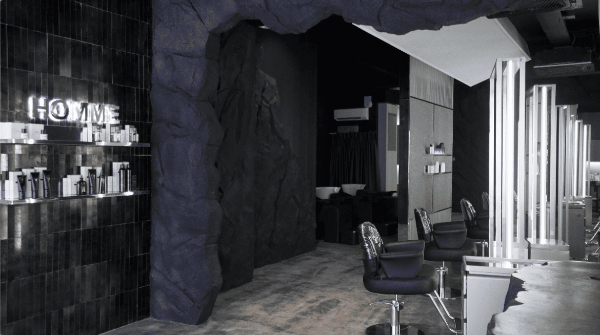 her maison homme hair salon salon salon design commercial spaces hairdresser hairdressing stephy yiwen design seed Alex Lee cave cave design cave walls wall treatments wall designs unique walls interior design interior spaces architecture carpentry curves textured wall masculine feminine contrasting