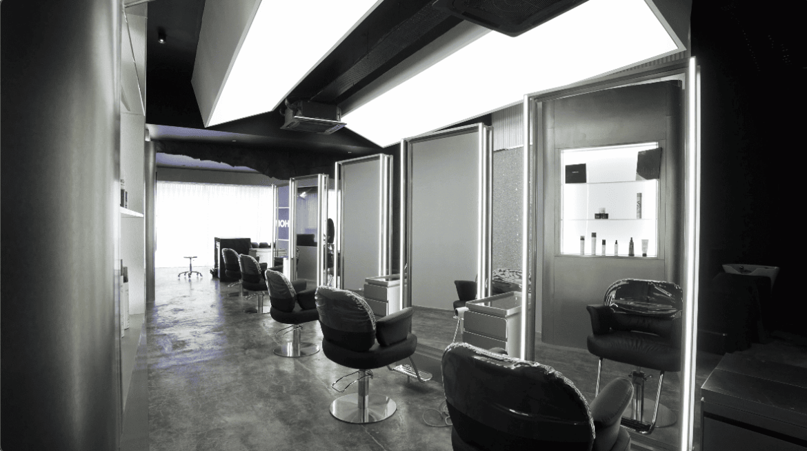 her maison homme hair salon salon salon design commercial spaces hairdresser hairdressing stephy yiwen design seed Alex Lee cave cave design cave walls wall treatments wall designs unique walls interior design interior spaces architecture carpentry curves textured wall masculine feminine contrasting