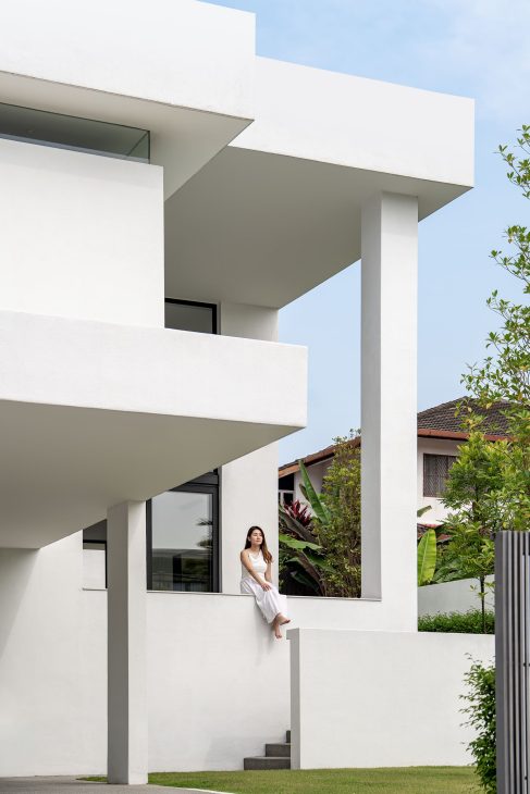 fabian tan design seed alex lee flovik house terrace house terrace house transformation malaysia extraordinary homes fabian tan architects architecture interior design split level home functionality minimalist minimal simple extension moving walls unique home unique walls layout kayout ideas home renovation home transformation house design house tour home tour connected space planning spatial flow living room koi pond landscaping lounge open spaces double volume moving panels light ventilation