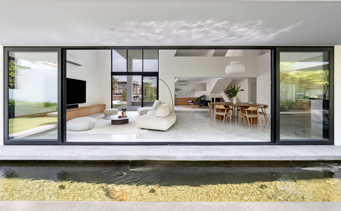 fabian tan design seed alex lee flovik house terrace house terrace house transformation malaysia extraordinary homes fabian tan architects architecture interior design split level home functionality minimalist minimal simple extension moving walls unique home unique walls layout kayout ideas home renovation home transformation house design house tour home tour connected space planning spatial flow living room koi pond landscaping lounge open spaces double volume moving panels light ventilation