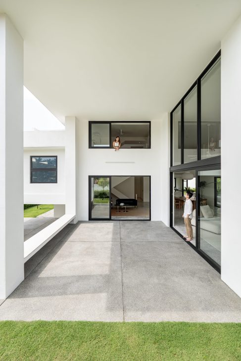 fabian tan design seed alex lee flovik house terrace house terrace house transformation malaysia extraordinary homes fabian tan architects architecture interior design split level home functionality minimalist minimal simple extension moving walls unique home unique walls layout kayout ideas home renovation home transformation house design house tour home tour connected space planning spatial flow living room koi pond landscaping lounge open spaces double volume moving panels light ventilation