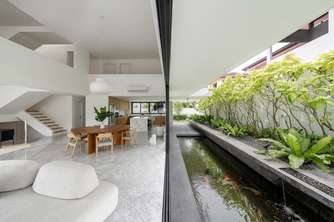 fabian tan design seed alex lee flovik house terrace house terrace house transformation malaysia extraordinary homes fabian tan architects architecture interior design split level home functionality minimalist minimal simple extension moving walls unique home unique walls layout kayout ideas home renovation home transformation house design house tour home tour connected space planning spatial flow living room koi pond landscaping lounge open spaces double volume moving panels light ventilation