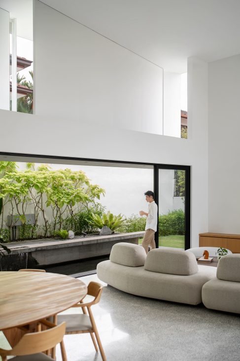 fabian tan design seed alex lee flovik house terrace house terrace house transformation malaysia extraordinary homes fabian tan architects architecture interior design split level home functionality minimalist minimal simple extension moving walls unique home unique walls layout kayout ideas home renovation home transformation house design house tour home tour connected space planning spatial flow living room koi pond landscaping lounge open spaces double volume moving panels light ventilation