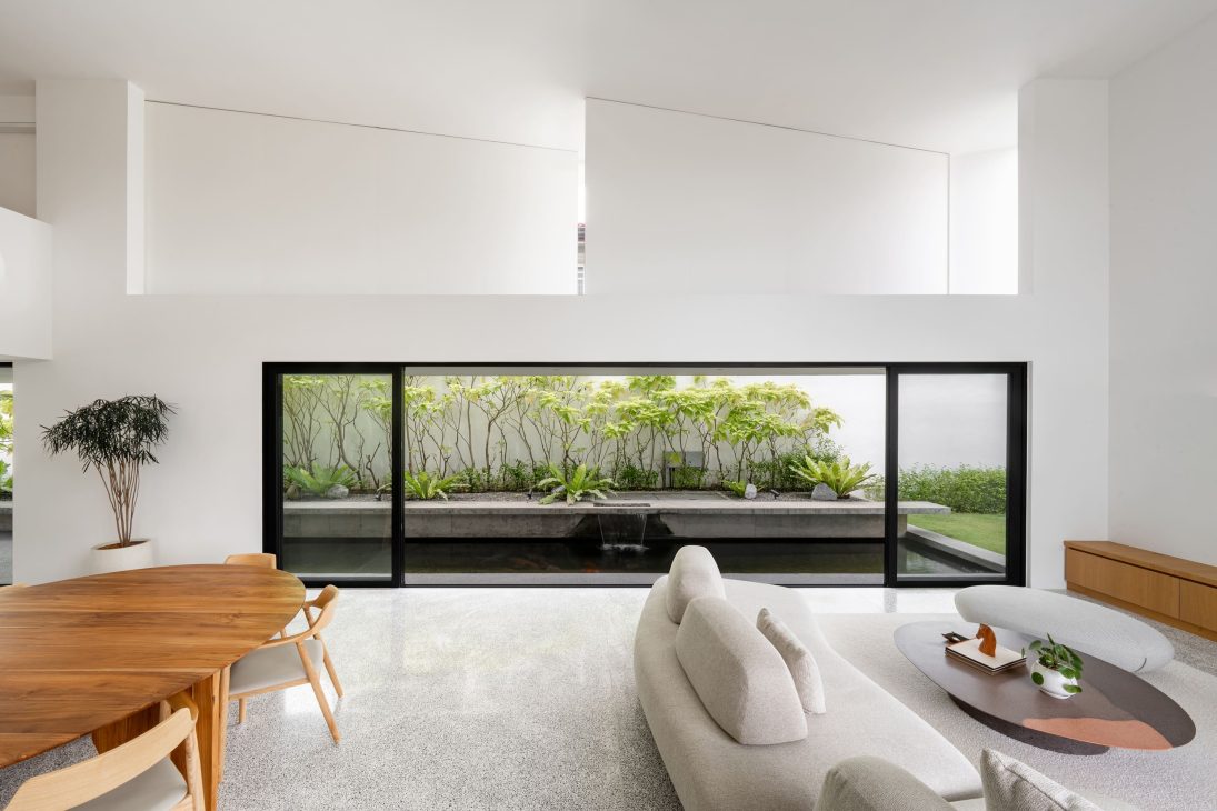 fabian tan design seed alex lee flovik house terrace house terrace house transformation malaysia extraordinary homes fabian tan architects architecture interior design split level home functionality minimalist minimal simple extension moving walls unique home unique walls layout kayout ideas home renovation home transformation house design house tour home tour connected space planning spatial flow living room koi pond landscaping lounge open spaces double volume moving panels light ventilation