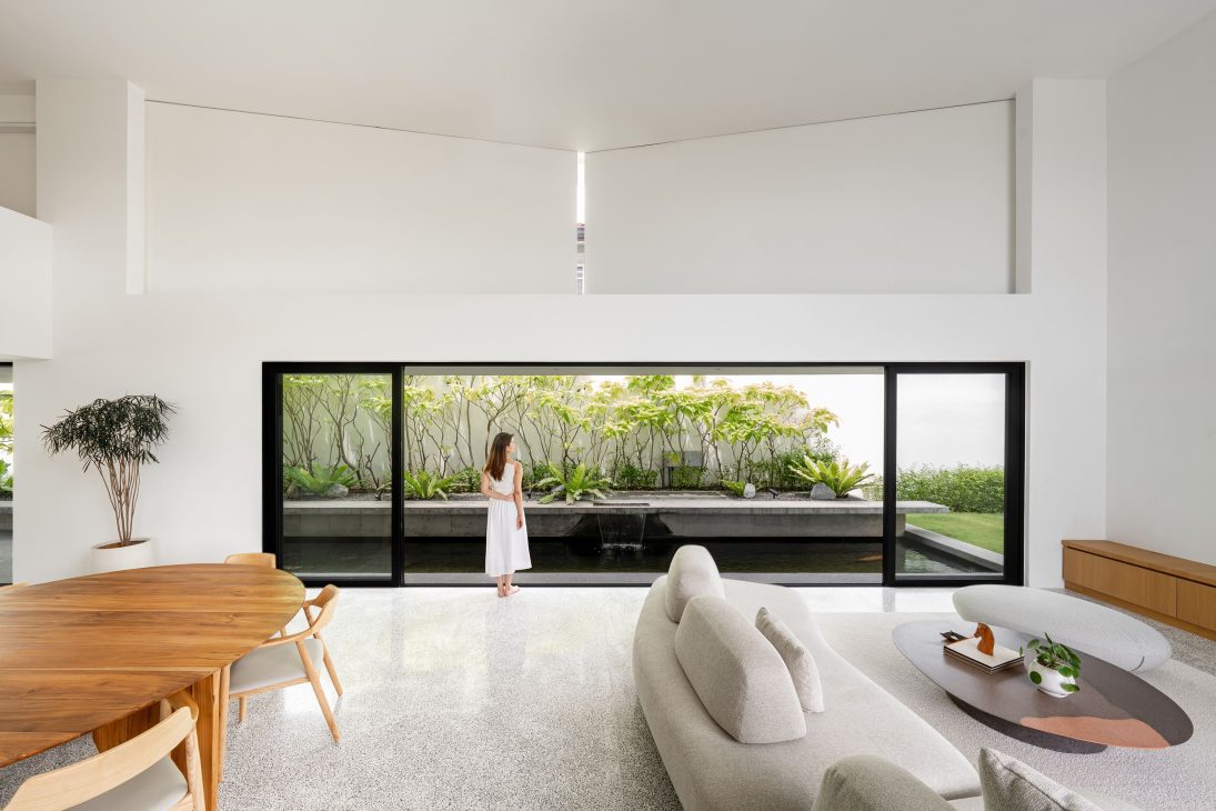 fabian tan design seed alex lee flovik house terrace house terrace house transformation malaysia extraordinary homes fabian tan architects architecture interior design split level home functionality minimalist minimal simple extension moving walls unique home unique walls layout kayout ideas home renovation home transformation house design house tour home tour connected space planning spatial flow living room koi pond landscaping lounge open spaces double volume moving panels light ventilation