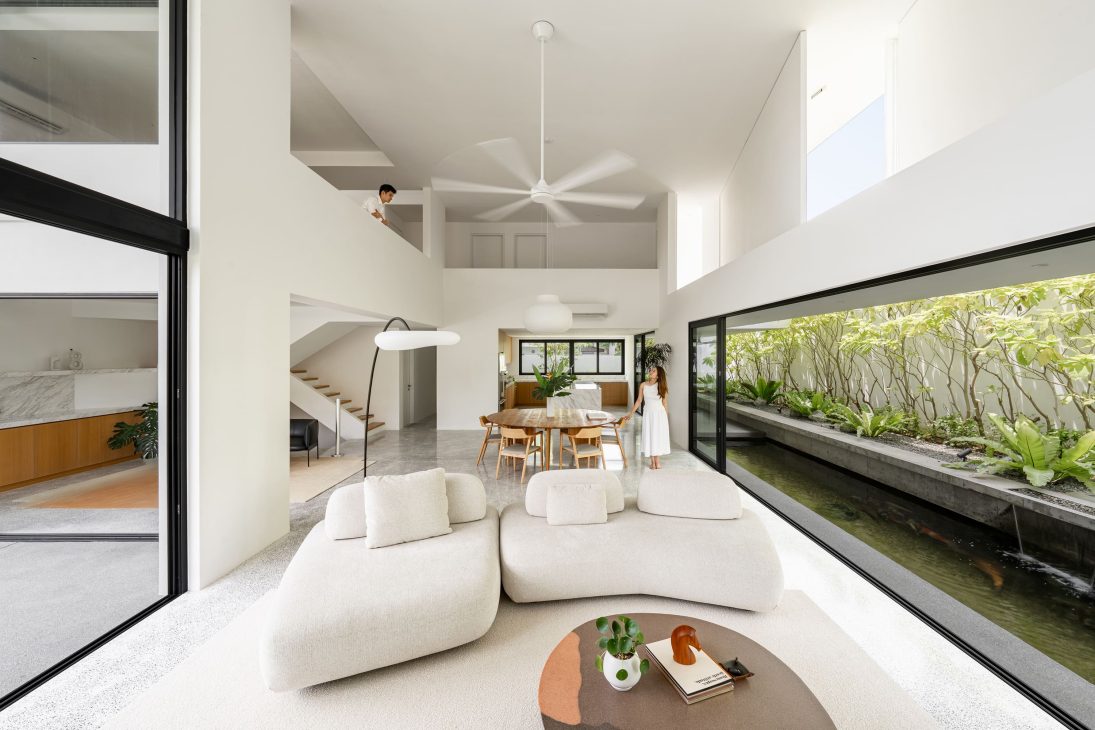 fabian tan design seed alex lee flovik house terrace house terrace house transformation malaysia extraordinary homes fabian tan architects architecture interior design split level home functionality minimalist minimal simple extension moving walls unique home unique walls layout kayout ideas home renovation home transformation house design house tour home tour connected space planning spatial flow living room koi pond landscaping lounge open spaces double volume moving panels light ventilation