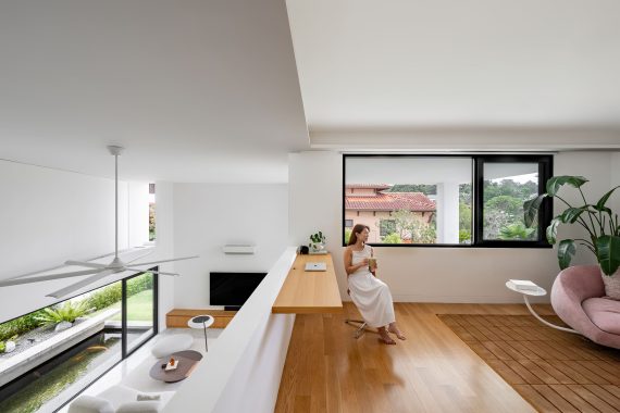 fabian tan design seed alex lee flovik house terrace house terrace house transformation malaysia extraordinary homes fabian tan architects architecture interior design split level home functionality minimalist minimal simple extension moving walls unique home unique walls layout kayout ideas home renovation home transformation house design house tour home tour connected space planning spatial flow living room koi pond landscaping lounge open spaces double volume moving panels light ventilation