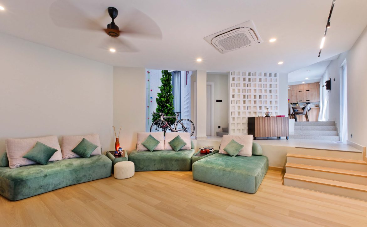 transformation house renovation changes renovation inspo urban garden house tropical concrete house architect architecture oscar tan showcase house tour home tour house inspo unique home climbing wall rock climbing split levels surprises cramped space spaces passions interests facade red facade colour red colour exterior stunning beautiful special aluminium panels heat tropical climate tropical house tropical living tropical design design ideas double skin layout plans passive cooling changes hobbies rock climbing skylight natural light tree indoor tree climbing feature compact house courtyard indoor courtyard vertical courtyard home elevator japanese rock garden serene living dining bedroom bathroom rooftop entertainment pool area sauna home sauna bathtub staircase unique stairs railing metal functional minimal perforated screen valve lounge deck