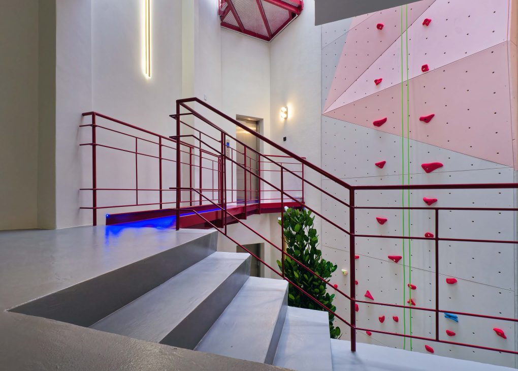 transformation house renovation changes renovation inspo urban garden house tropical concrete house architect architecture oscar tan showcase house tour home tour house inspo unique home climbing wall rock climbing split levels surprises cramped space spaces passions interests facade red facade colour red colour exterior stunning beautiful special aluminium panels heat tropical climate tropical house tropical living tropical design design ideas double skin layout plans passive cooling changes hobbies rock climbing skylight natural light tree indoor tree climbing feature compact house courtyard indoor courtyard vertical courtyard home elevator japanese rock garden serene living dining bedroom bathroom rooftop entertainment pool area sauna home sauna bathtub staircase unique stairs railing metal functional minimal perforated screen valve lounge deck