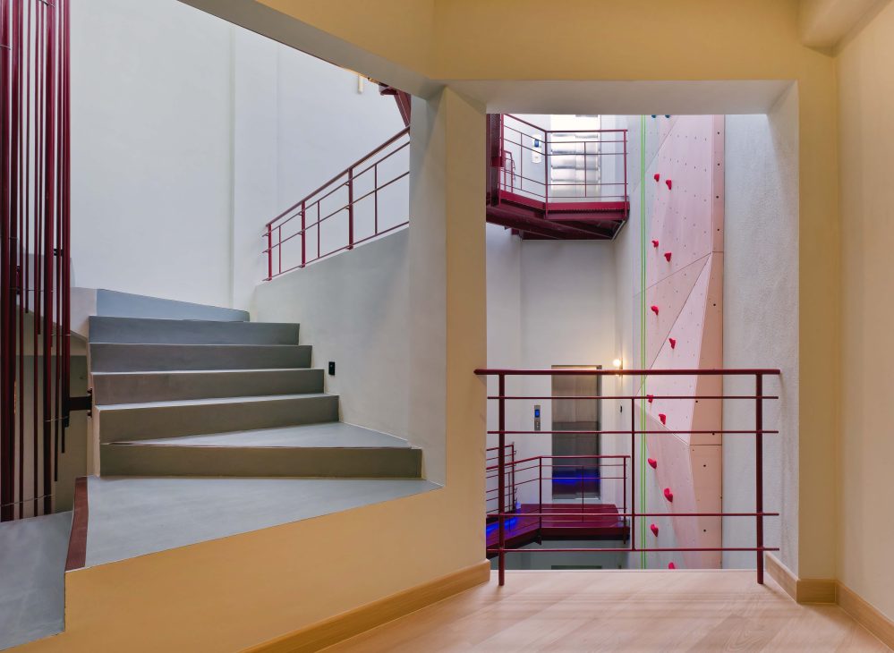 transformation house renovation changes renovation inspo urban garden house tropical concrete house architect architecture oscar tan showcase house tour home tour house inspo unique home climbing wall rock climbing split levels surprises cramped space spaces passions interests facade red facade colour red colour exterior stunning beautiful special aluminium panels heat tropical climate tropical house tropical living tropical design design ideas double skin layout plans passive cooling changes hobbies rock climbing skylight natural light tree indoor tree climbing feature compact house courtyard indoor courtyard vertical courtyard home elevator japanese rock garden serene living dining bedroom bathroom rooftop entertainment pool area sauna home sauna bathtub staircase unique stairs railing metal functional minimal perforated screen valve lounge deck