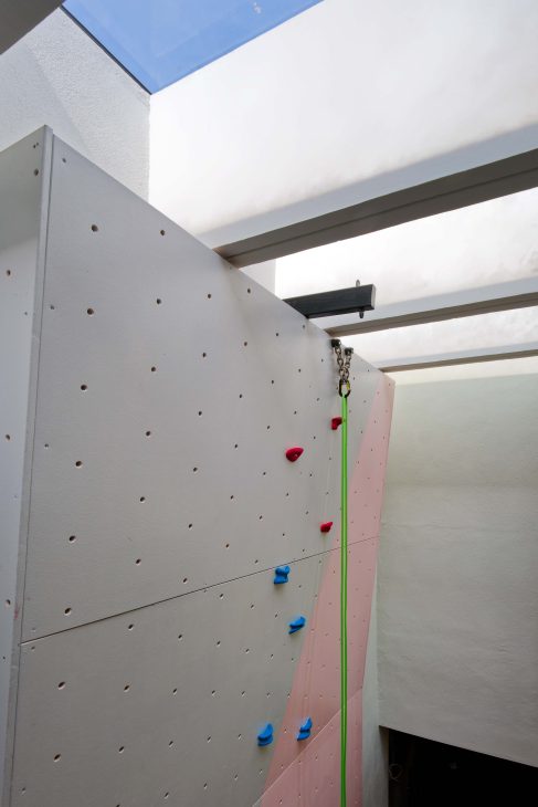 transformation house renovation changes renovation inspo urban garden house tropical concrete house architect architecture oscar tan showcase house tour home tour house inspo unique home climbing wall rock climbing split levels surprises cramped space spaces passions interests facade red facade colour red colour exterior stunning beautiful special aluminium panels heat tropical climate tropical house tropical living tropical design design ideas double skin layout plans passive cooling changes hobbies rock climbing skylight natural light tree indoor tree climbing feature compact house courtyard indoor courtyard vertical courtyard home elevator japanese rock garden serene living dining bedroom bathroom rooftop entertainment pool area sauna home sauna bathtub staircase unique stairs railing metal functional minimal perforated screen valve lounge deck