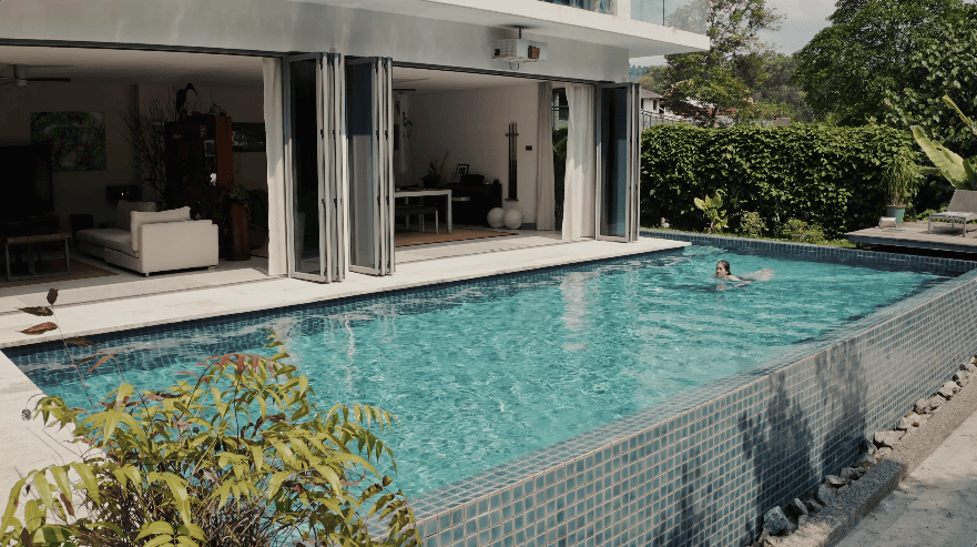 hidden forest home greenery jungle home house design seed martin haeger HL Design Group Bukit Antarabangsa Selangor Malaysia overgrown frameless glass doors sanctuary intimate nature outdoors privacy bungalow bungalow design layout blueprint plan unique unique homes family home swimming pool beach personal beach pavilion pond artist art paintings pottery architect architecture own home house tours calm biophilic design green granite waterfalls living room interior design transformation renovation guitar galvanized steel staircase open terrace sundeck tropical rain gutters overhanging roofs pitched roof double volume open jacuzzi master bedroom unique bathroom escape animals farm mini farm dogs cats chickens trees plants edibles outdoor jacuzzi outdoors cross ventilation loft bed art studio pottery room creativity entertainment space studio landscaping garden reserve forest natural ventilation sustainability space natural