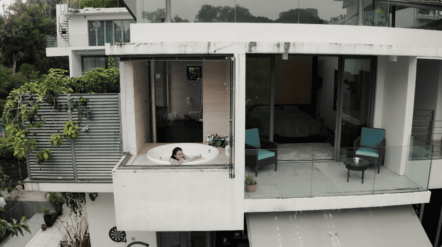 hidden forest home greenery jungle home house design seed martin haeger HL Design Group Bukit Antarabangsa Selangor Malaysia overgrown frameless glass doors sanctuary intimate nature outdoors privacy bungalow bungalow design layout blueprint plan unique unique homes family home swimming pool beach personal beach pavilion pond artist art paintings pottery architect architecture own home house tours calm biophilic design green granite waterfalls living room interior design transformation renovation guitar galvanized steel staircase open terrace sundeck tropical rain gutters overhanging roofs pitched roof double volume open jacuzzi master bedroom unique bathroom escape animals farm mini farm dogs cats chickens trees plants edibles outdoor jacuzzi outdoors cross ventilation loft bed art studio pottery room creativity entertainment space studio landscaping garden reserve forest natural ventilation sustainability space natural