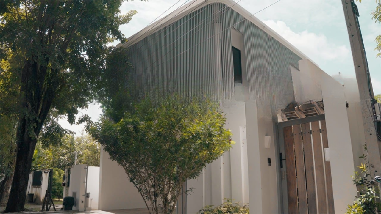 design seed alex lee design interior design house house tour homes architect architecture Aurum Development Company enveloped house retirement retire migrate thailand chiang mai suburb house home renovation transformation modern contemporary house design travel nature greenery landscape borrowed landscape construction buy property sell property house sale build lifestyle green relax philosophy luxury luxrious luxury homes facade curved modern timeless compact small cozy cosy living room sunken pocket garden car porch window daybed swimming pool pool city environment trees forest daybed breeze cross ventilation funnel unwind perfect spot structure capella upper floor bridge patio cool summer winter outdoor sunlit courtyard mornings ccalming sun orientation sun position kitchen dining wing layout unique views marble private quiet guest room villa tropical sanctuary comfort homey warm wood balcony bedroom master bedroom balcony terrace shiba inu dogs pets window bay seating tiles bathroom sleek developers land concrete developments peace peaceful tropical homes beautiful