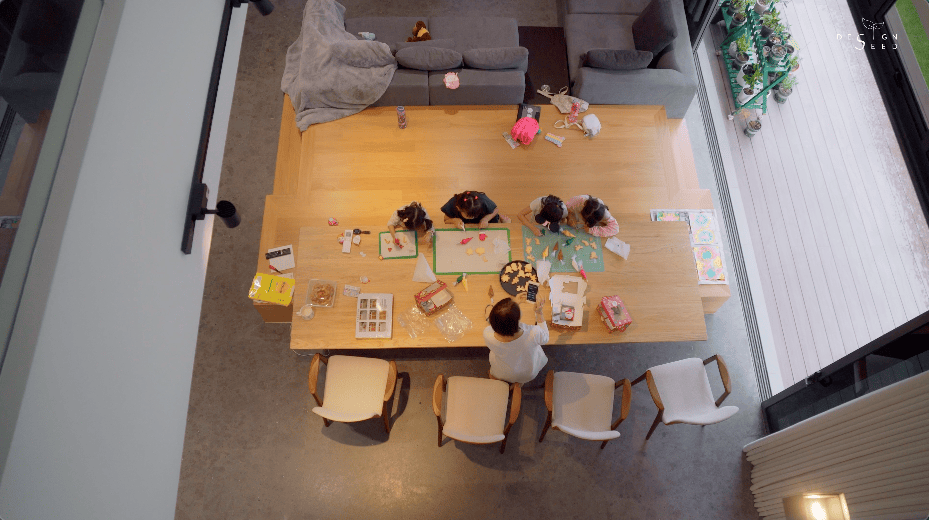 japan japanese japandi minimalist luxury house home family Nu Infinity Design seed Alex Lee interior design architecture house tour bungalow design garden greens greenery living room kitchen open plan open plan living and dining double volume smart home technology contemporary modern family kids friendly development malaysia design wooden wood platform multifunctional furniture bench table dining table entrance first floor study workspace kids