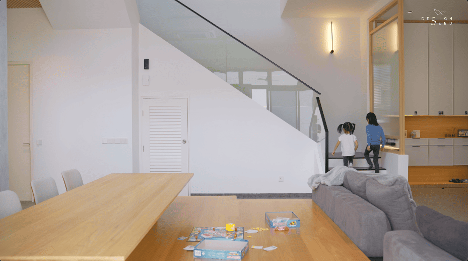 japan japanese japandi minimalist luxury house home family Nu Infinity Design seed Alex Lee interior design architecture house tour bungalow design garden greens greenery living room kitchen open plan open plan living and dining double volume smart home technology contemporary modern family kids friendly development malaysia design wooden wood platform multifunctional furniture bench table dining table entrance first floor study workspace kids