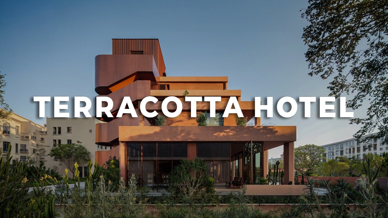 A Hotel Designed for Book Lovers | Red Concrete Facade | Interior Design & Architecture Ideas